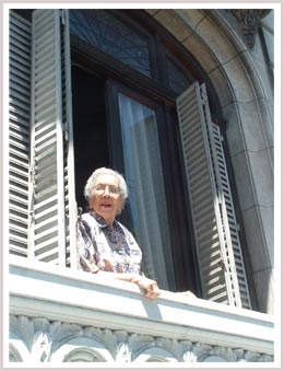 An image of a woman Spending time in her balcony