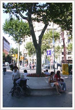 An image of a people sitting in a public square