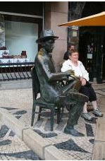 Opportunity for passers buy to sit alongside a sculpture in Lisbon